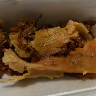 I tried to move it and it completely crumbled apart in a wet mushy mess. I love tamales but this was unbearably bad.