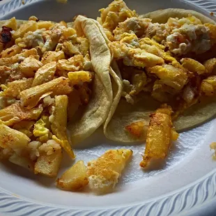 Potatoes and eggs make sure you get there sauce its a little dry.