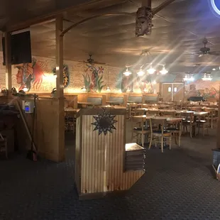 a dining area with tables and chairs