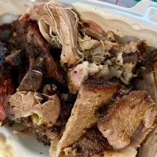 Ribs, pulled pork, brisket (three meat combo.) Hard to tell from the photo but there was a lot of meat.