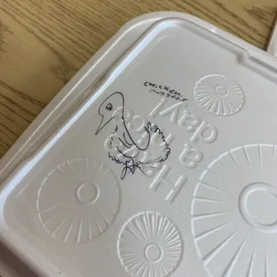 funny artwork on the meal container that made us laugh