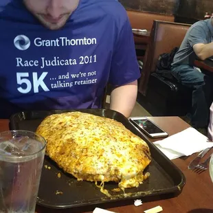 William doing the burrito challenge on Cinco, representing the Detroit Research team at JMJ Phillip