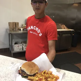 Bacon cheeseburger with french fries with ketchup and mustard