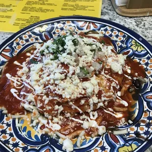happy stack of red-sauced huevos rancheros (includes black beans and rice!)
