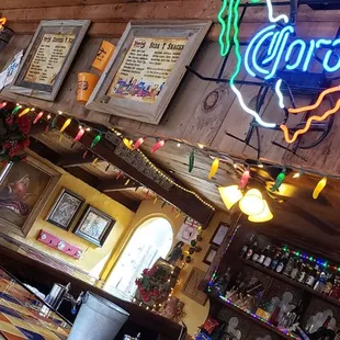 a neon sign above the bar