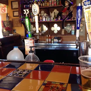 a pint of beer on the bar