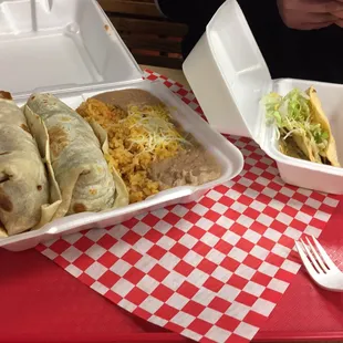 2 steak burritos meal and a steak taco