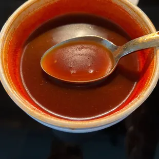 Oily broth chock full of chipotle chili powder. Guaranteed heartburn after two bites. And no chicken.