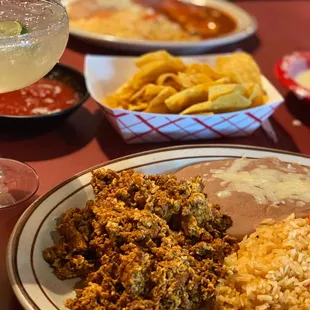 Chorizo with eggs and rice and beans with a cheese enchilada plate and a skinny margarita!