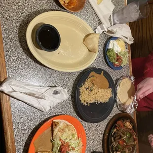 Sopapillas (one left), brisket quesadilla, chicken fajitas, rice, beans