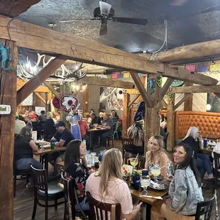 a group of people eating at a restaurant