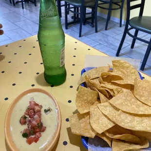 Chips and Queso! The chips are thick, crunchy and have a slight seasoning on them! Very tasty! Also Mexican sprite!