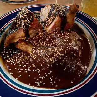 Chicken with red and black mole.