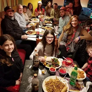 Family enjoying their Christmas Eve dinner.