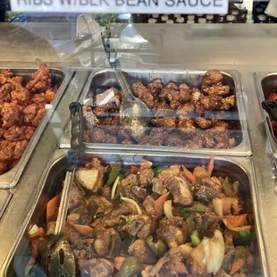 a variety of food in a buffet