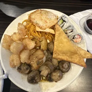 Mushrooms, crab rangoons, amazing potatoes, and sushi