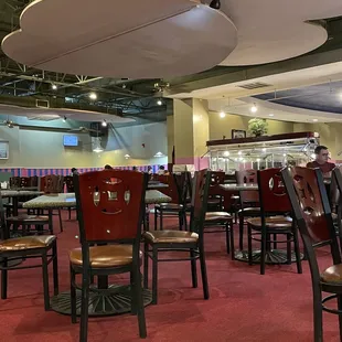 a man sitting at a table in a restaurant