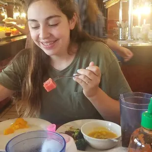 a woman eating a meal at a restaurant