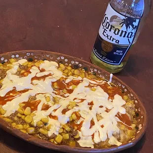 a beer and a plate of food