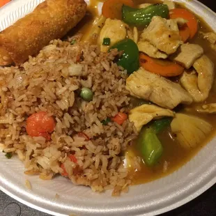 Curry chicken with fried rice and an egg roll.