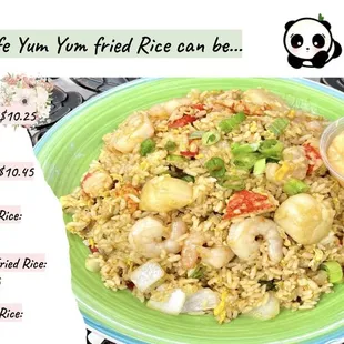 a plate of fried rice with shrimp and vegetables