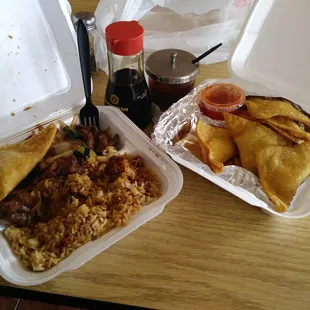 two take out containers of food