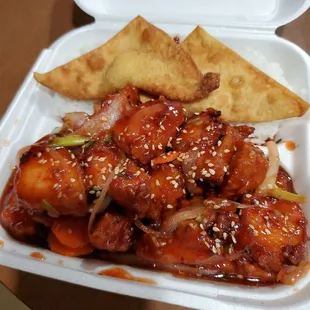 a takeout container with chicken