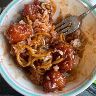 General Tsos chicken mixed with white rice and lo mein