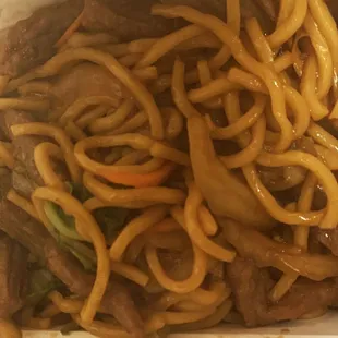 beef and noodles in a takeout container