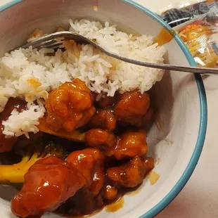 a bowl of rice and broccoli