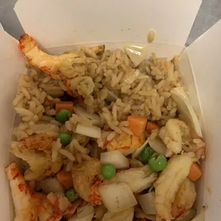 rice and vegetables in a take out box