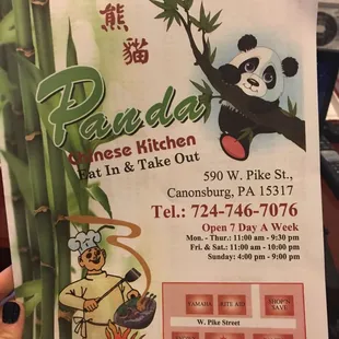 a person holding up a menu