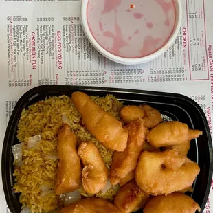 a tray of fried chicken and rice