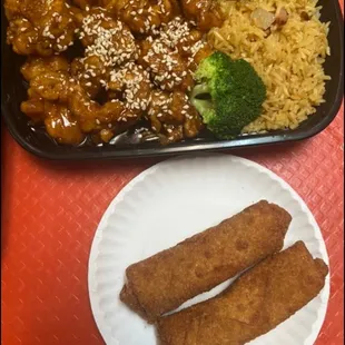 a plate of rice, chicken, and broccoli