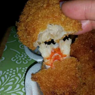 Large hard oily corn meal plank, with a small fishy tough shrimp inside!