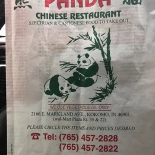 a panda sitting on a piece of paper