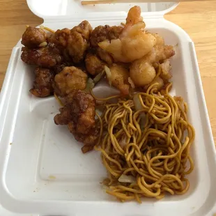 Chow Mein, Walnut shrimp, Orange chicken.  When I pushed it aside (barely) that's what the portion was.