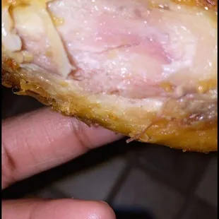 Fried Chicken Wings RAW on the inside &amp; smelled freezer burned.