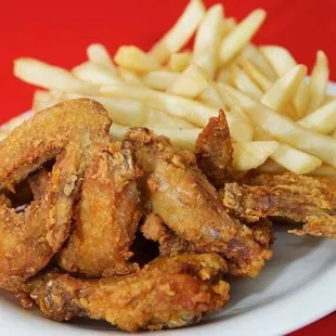 a plate of fried chicken and french fries