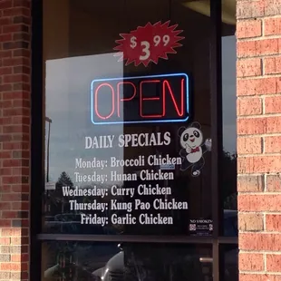 open sign in window of restaurant