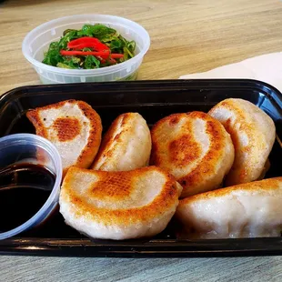 Beef jiaozi and seaweed salad.