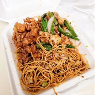 a plate of noodles with meat and vegetables