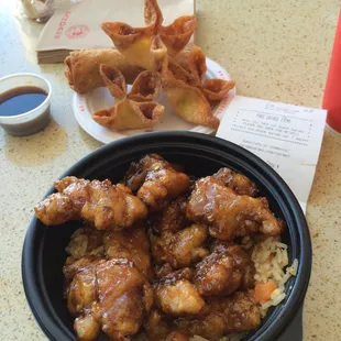 Orange chicken. Ragoons and egg roll, foreground.