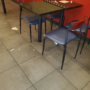 a table and chairs in a restaurant