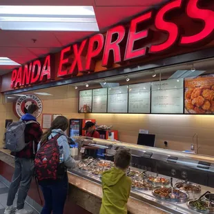 people standing in line at the counter