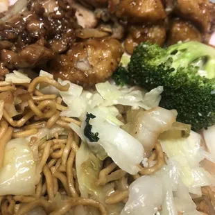 The plate Pepper chicken 7/10, Grilled Teriyaki Chicken 7/10 And Orange Chicken 8/10,  Chow Mein 6/10 and Side Super Greens 8/10 on 04/21/22