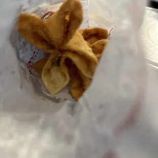 Cream cheese rangoons in paper bag