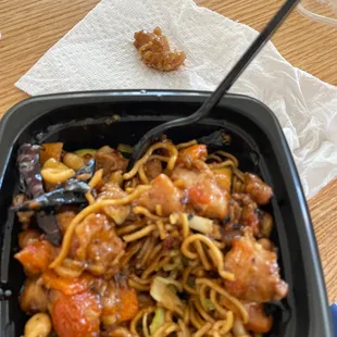 a bowl of noodles and chopsticks