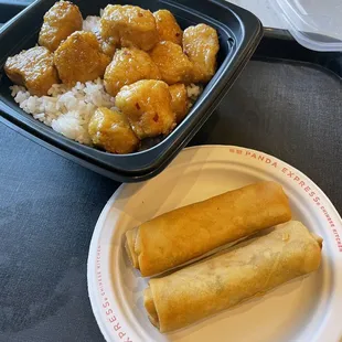 a plate of fried food and a bowl of rice