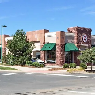 Store viewed from Marshall &amp; Center, looking northwest. This store is in its own building. Entrance and parking are around to the right.